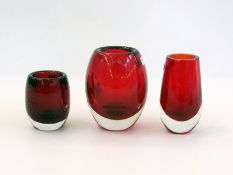 Two small red vases and one red bubbles