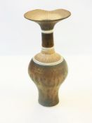Lucie Rie (1902-1995) stoneware vase with flared rim to cylindrical neck and baluster base, bronze