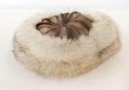 A fox fur cap with fur crown and hat sta