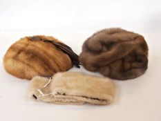 A Mitzi Lorenz mid-brown mink hat, anoth