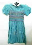 A child's silk party dress with smocking