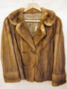 A mink jacket with buttons