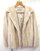 A cream mink jacket, with a removable ha
