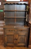 A reproduction oak dresser, with two she