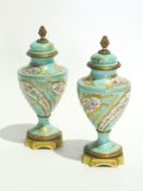 A pair of Sevres porcelain lidded urns w