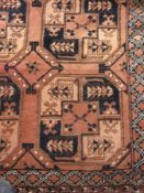 Afghan design wool rug, with russet fiel