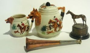 A teapot with fox hunting scene in the s