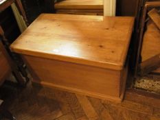 A pine blanket box with side carrying ha