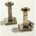 A pair of dwarf silver candlesticks, ind