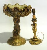 Gilded candlestick with cherubs to the e