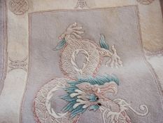 Chinese wool rug with central dragon des