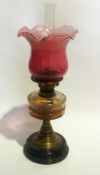 Large Victorian oil lamp with red glass