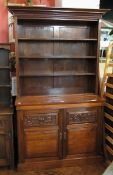 A Victorian walnut bookcase, the top wit