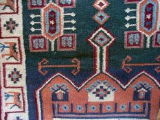 Pair of Shirvan wool rugs, central medal