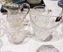 Three cut glass jugs and a moulded glass