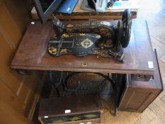 Black and gilt metal treadle sewing mach