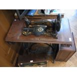 Black and gilt metal treadle sewing mach