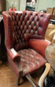 Red leather buttonback tub chair