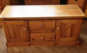 A modern pine rectangular topped chest w