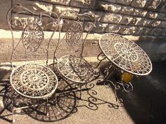 A cast iron garden table, with two match