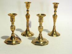 Two pairs of cast brass candlesticks rai