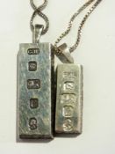 Two silver ingot pendants and chains, 1.