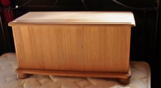A modern pine blanket box with moulded e