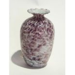 An ovoid-shaped studio glass vase with w