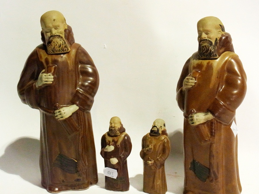 Two large ceramic monk decanters and two