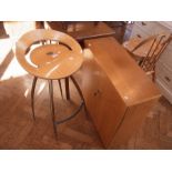 A contemporary high stool with shaped la