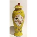 A Chinese yellow ground vase with cover,