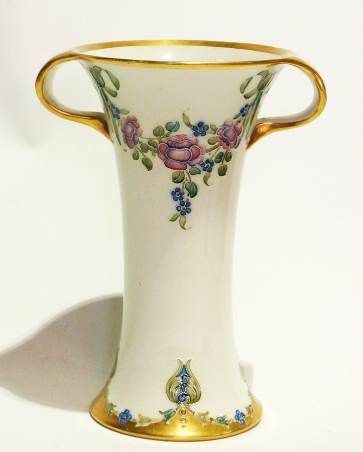 William Moorcroft - James MacIntyre & Co waisted two-handled vase, rose garland pattern, cream