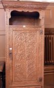 Victorian carved oak cupboard with open