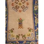 Chinese washed wool rug with central pin