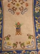 Chinese washed wool rug with central pin