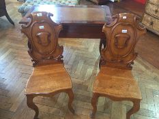 Pair of Victorian oak hall chairs with c