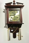 A wall clock, a barometer and clock book