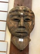 A wooden African mask, a small African m