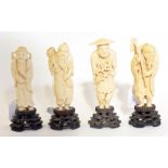 A set of four Japanese carved ivory figu