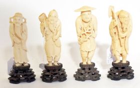 A set of four Japanese carved ivory figu