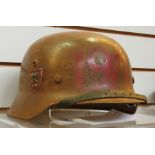 A WWII German army M40 helmet with leath