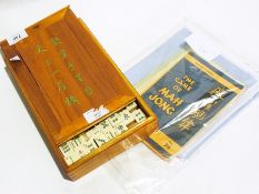 A lacquered Mahjong box rests and boxed