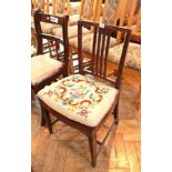 A mahogany dining chair with upholstered seat,