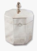 A George V octagonal silver tea caddy of plain form with acorn finial, London 1916,