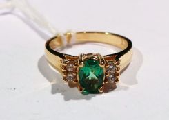 Emerald and diamond ring set centre oval