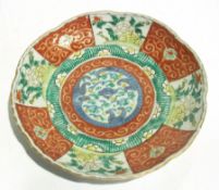 Three famille verte pottery plates, 21 cms diam.