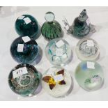 A selection of paperweights including Se