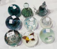 A selection of paperweights including Se