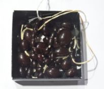 String of dark red amber graduated beads (in need of restringing )