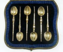 A set of six silver-gilt coffee spoons o